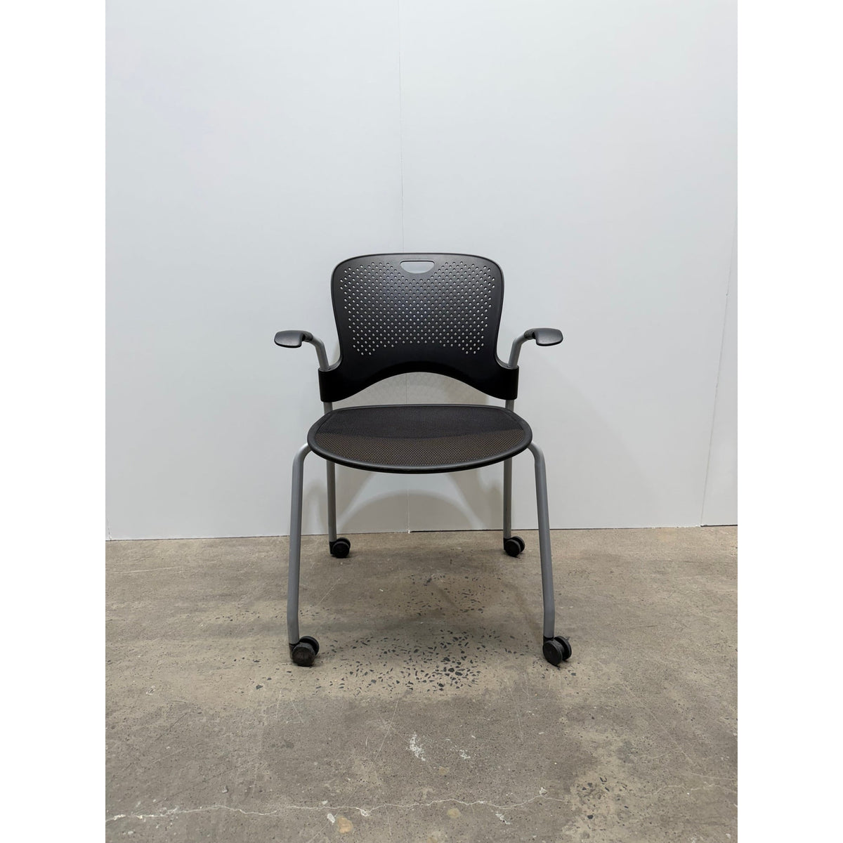 Herman Miller Caper Stacking Chair, Black, Fixed Arms, Castors - thegoodchairs